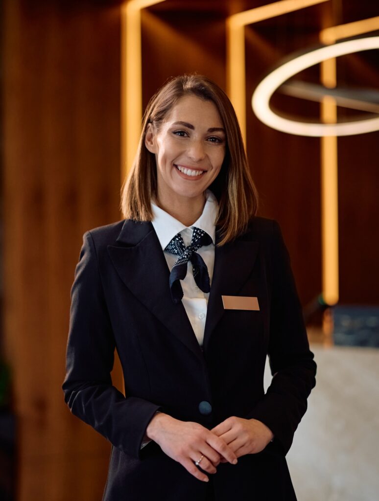 Portrait of happy female hotel manager looking at camera.